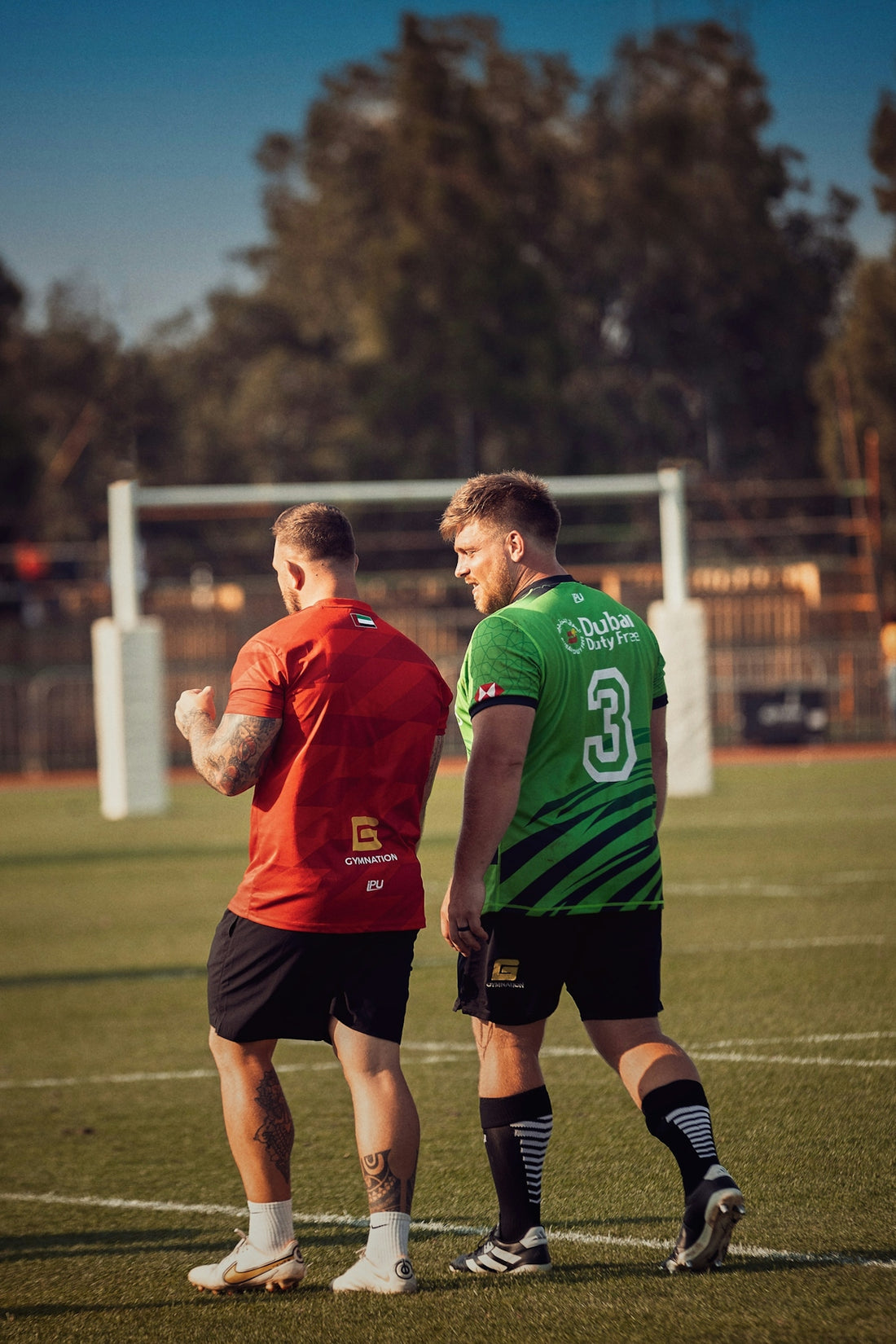 Two rugby players on a field