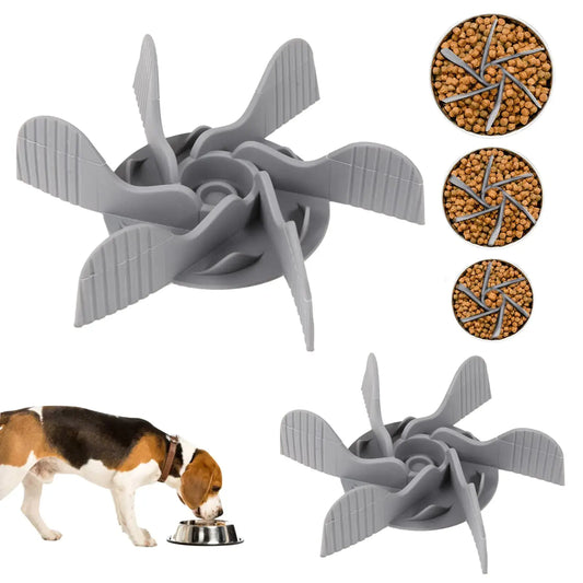 Gray dog toy with fan-like design, shown with a dog and food on a white background.